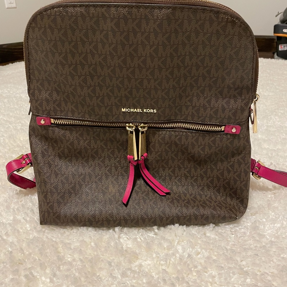 Michael Kors Backpack purse. Slight wear shown in the last two pics.